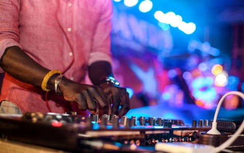 zoomed in picture of the dj playing music 