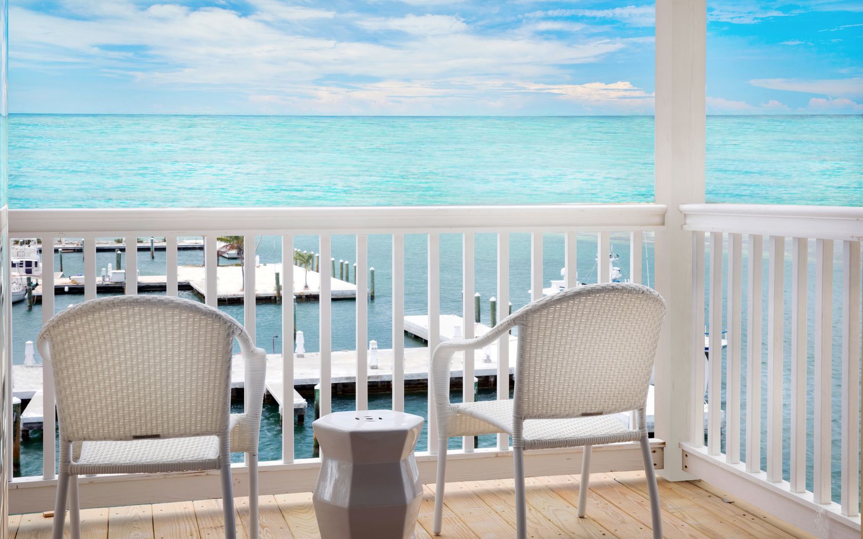 water view balcony with two white chairs