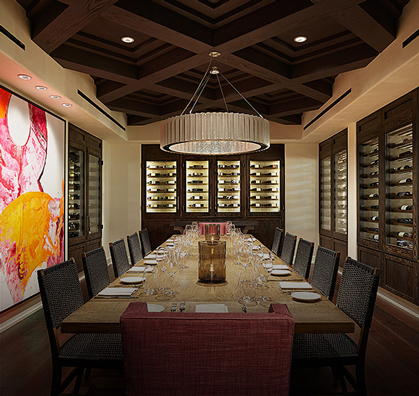 view of a sophisticated restaurant room with a table already setup during the day