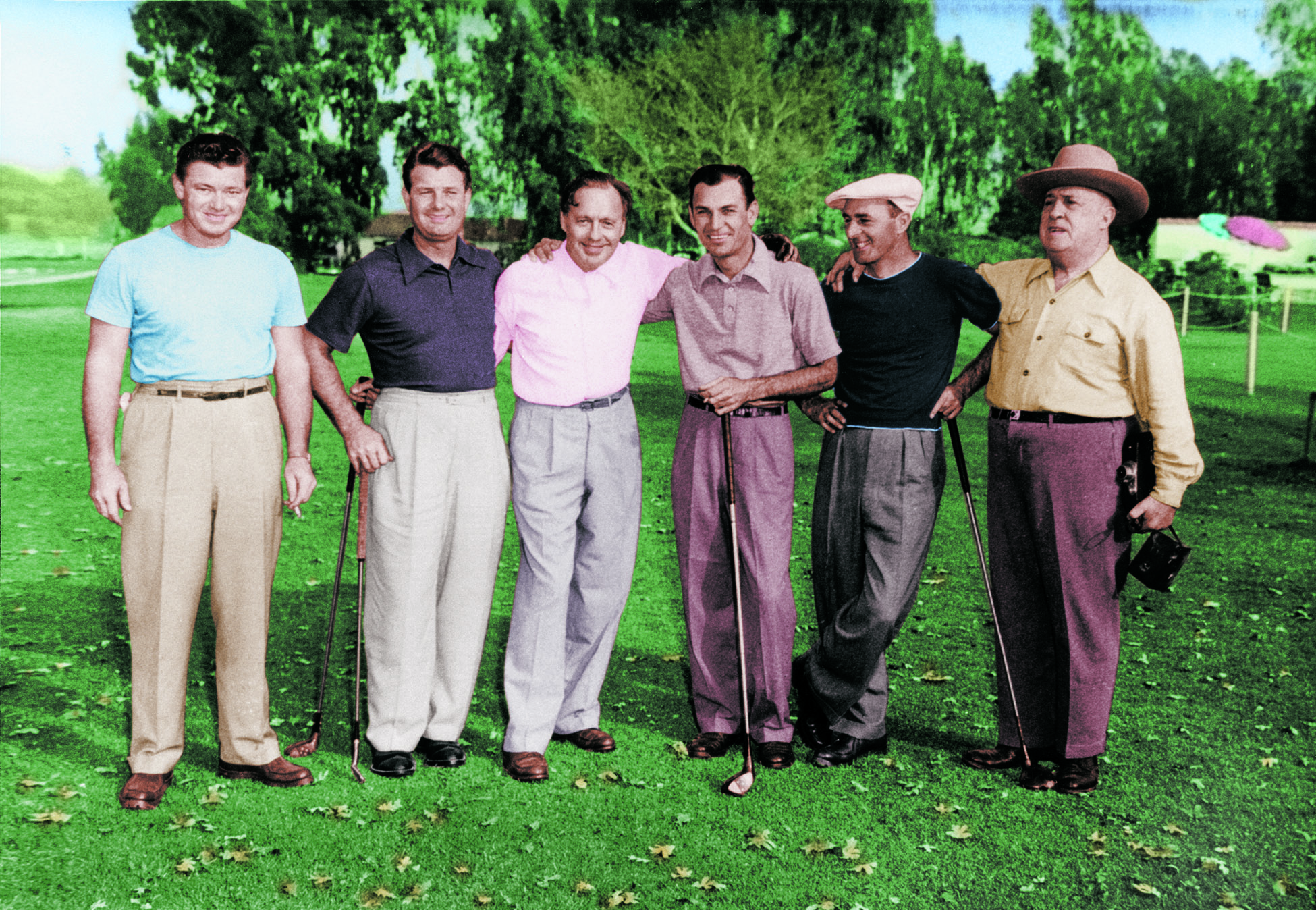 Group of six men standing on a golf course hand in hand
<span id=
