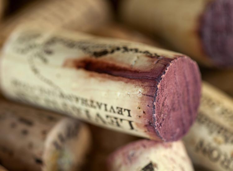close up view of bunch of red wine corks