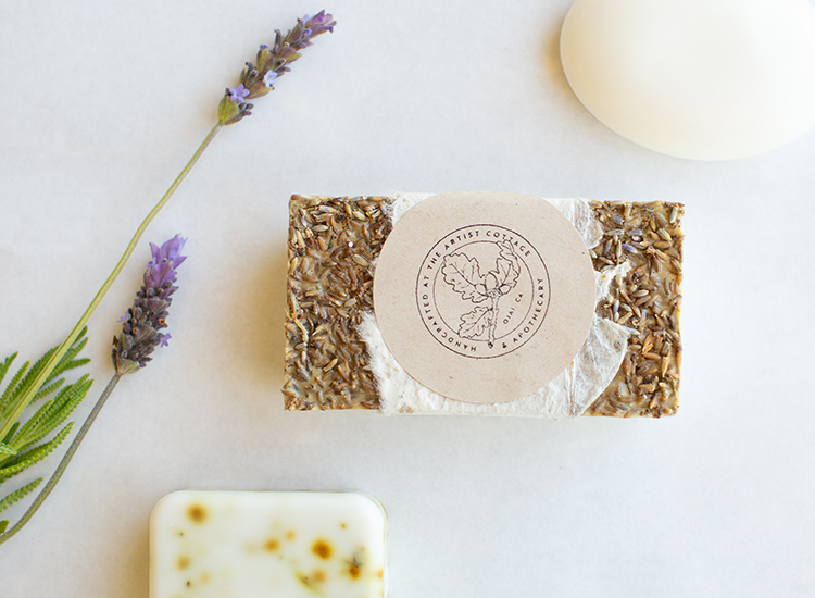 soap bar covered in grains with lavender next to it