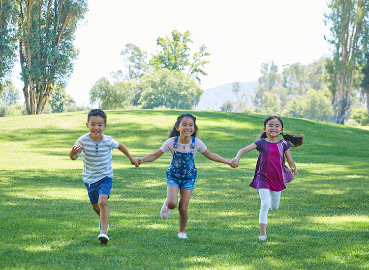 kids running holding hands