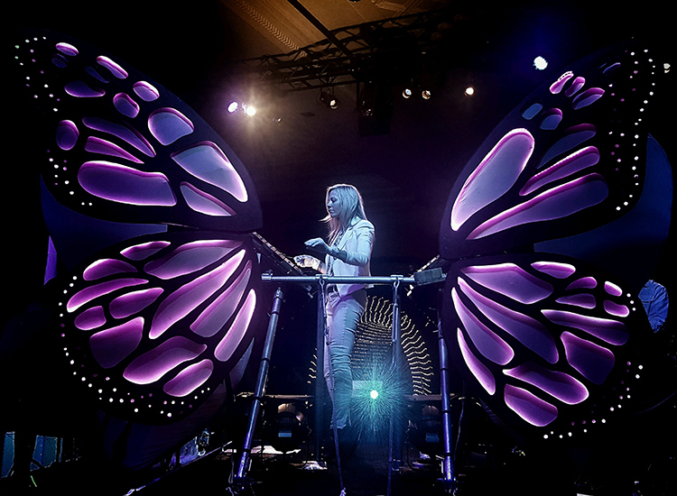 Woman standing in butterfly wings