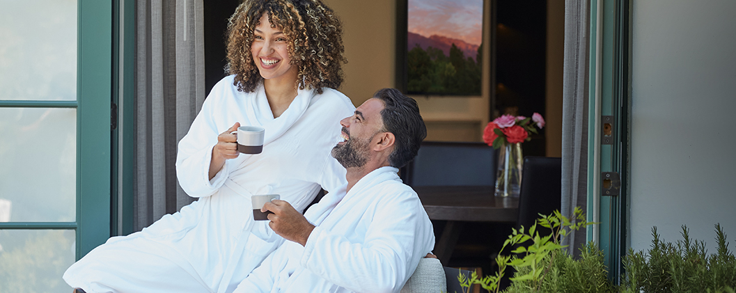 Couple enjoying coffee while in robes