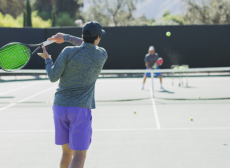 two guys playing tennis