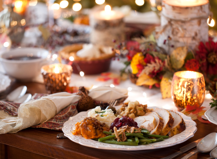Close up of a set table with a thanksgiving meal 
