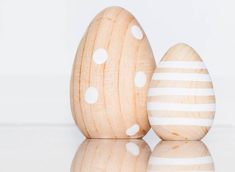 wooden eggs with designs on them