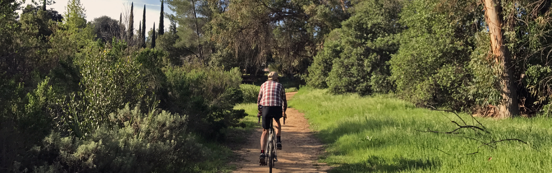 guy riding a bike in a landscape 
