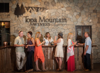 people at the entrance of Topa Mountain Winery