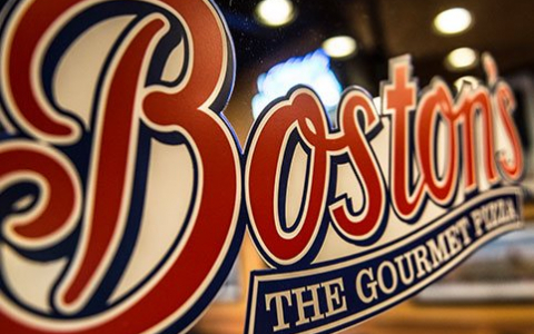 Bostons restaurant logo on a glass door