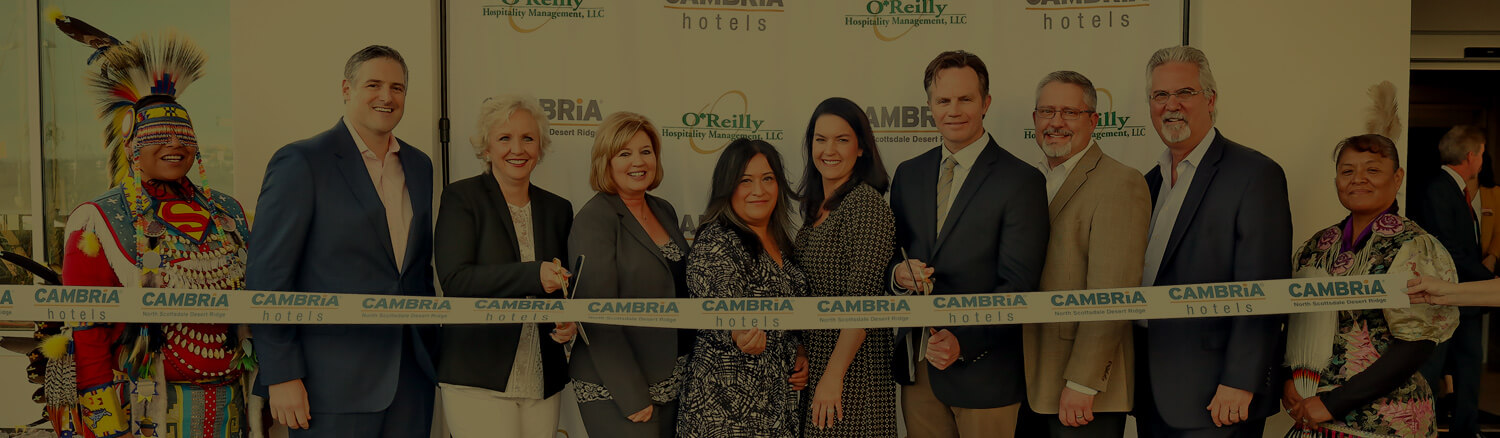 Group of associates posing at a Cambria ribbon cutting ceremony