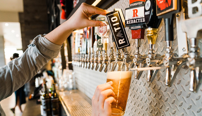 beer being poured from tap