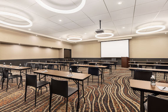 meeting room with tables and projector