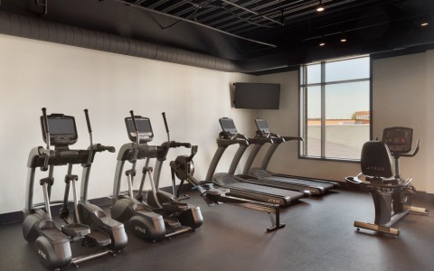 fitness center with equipment and machines