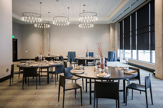 large room with multiple chairs and tables