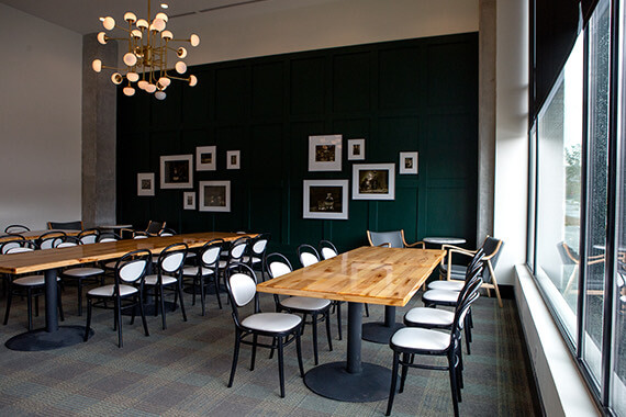 two long rectangular tables in a meeting room