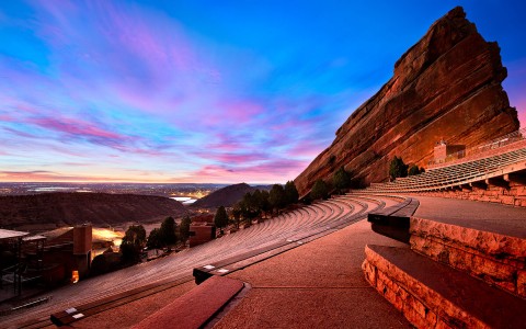 view of red rocks with a blue and pink sky