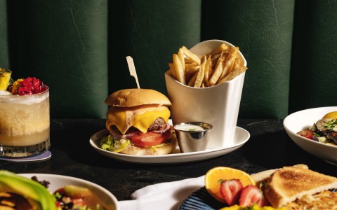 burger and fries with other dishes