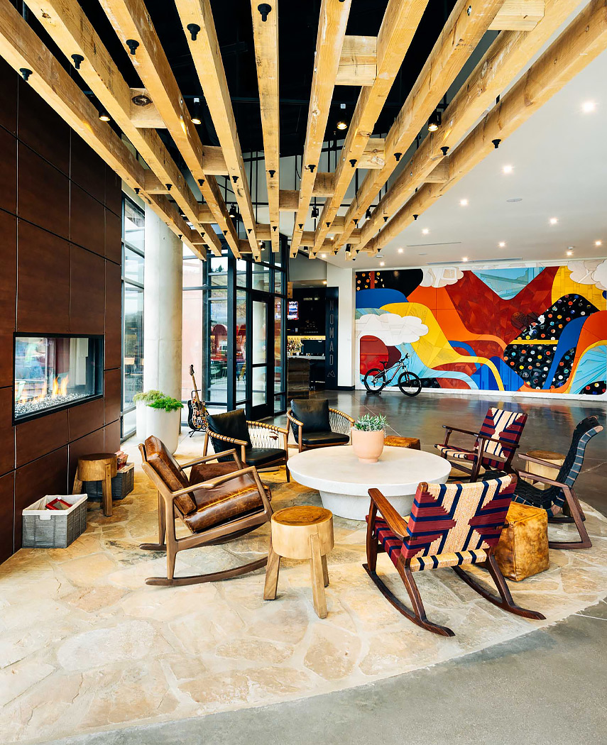 hotel lounge with round small table surrounded by tribal patterned chairs