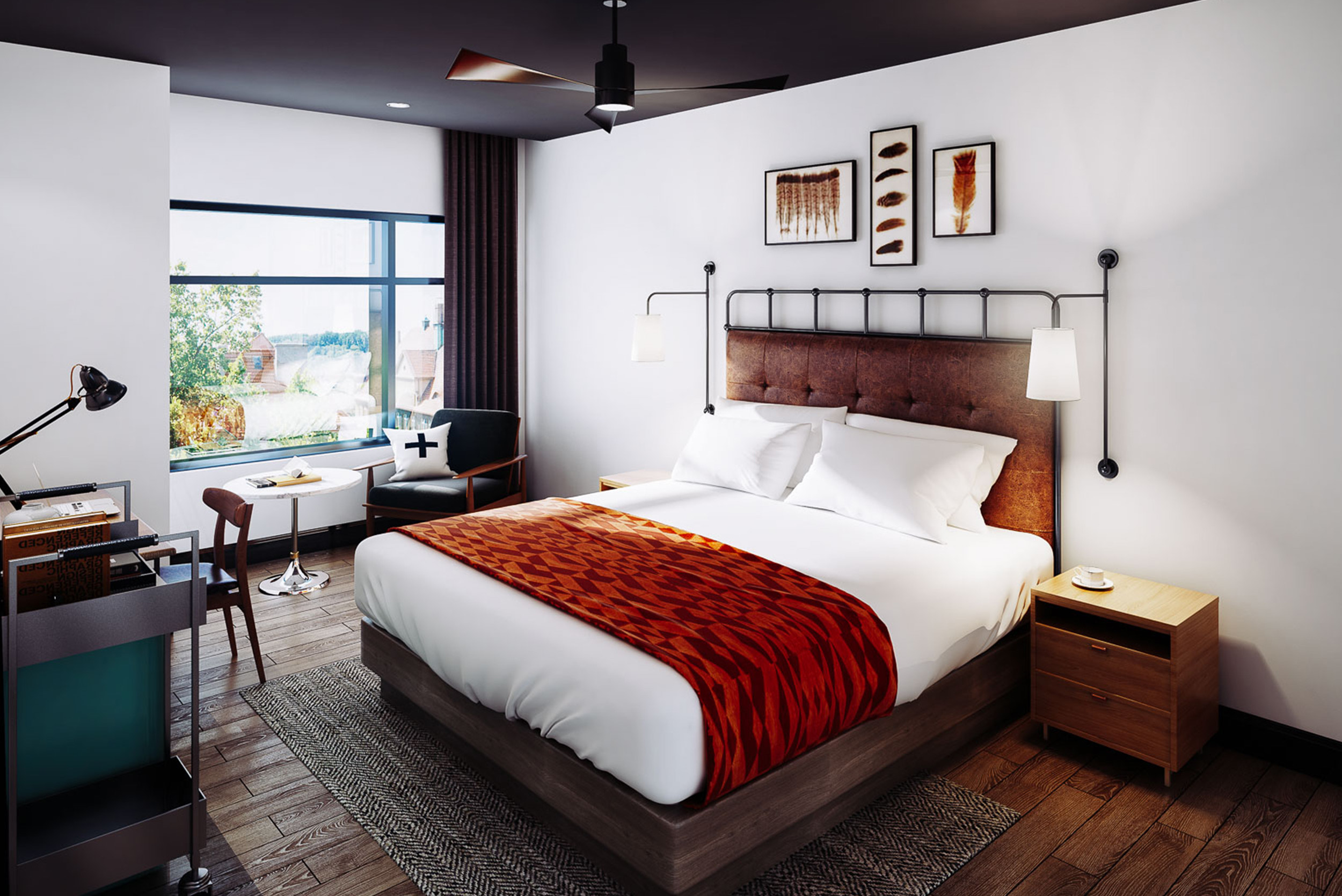 king bed with bright window and garnet accent blanket