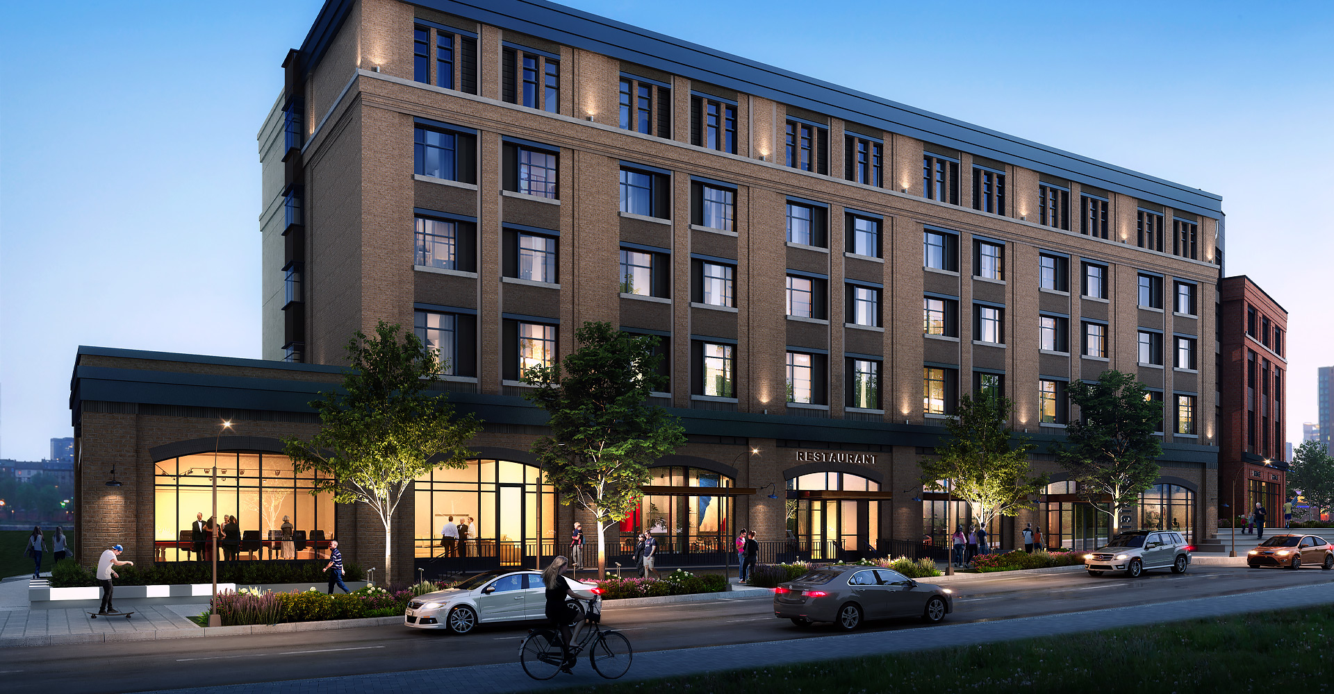 exterior of hotel with windows lit up at night time
