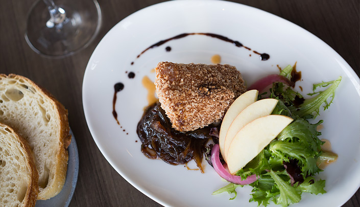 aerial plate of a slice of fish and a garden salad