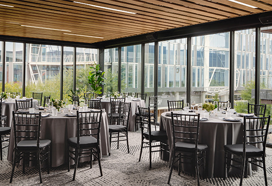 flight room with a ton of event tables and seating