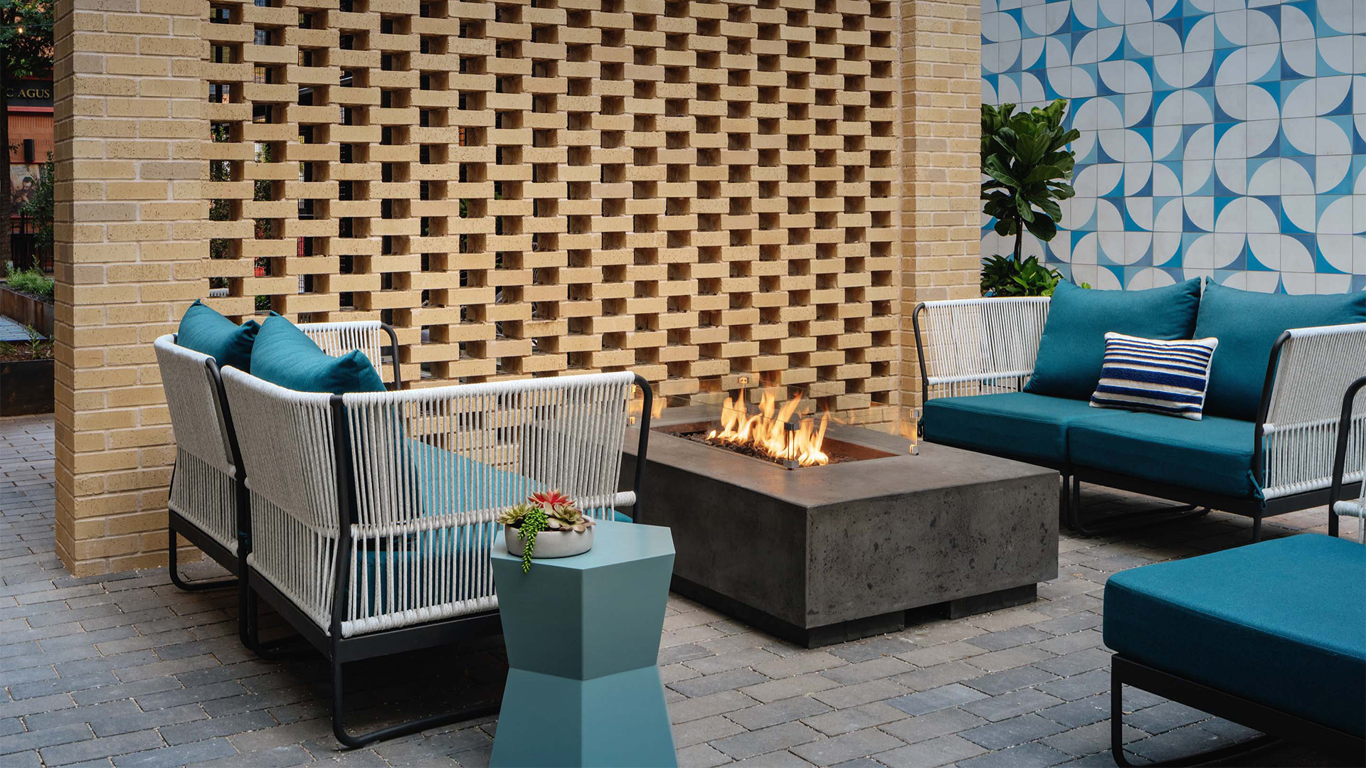two outdoor patio chairs with a firepit