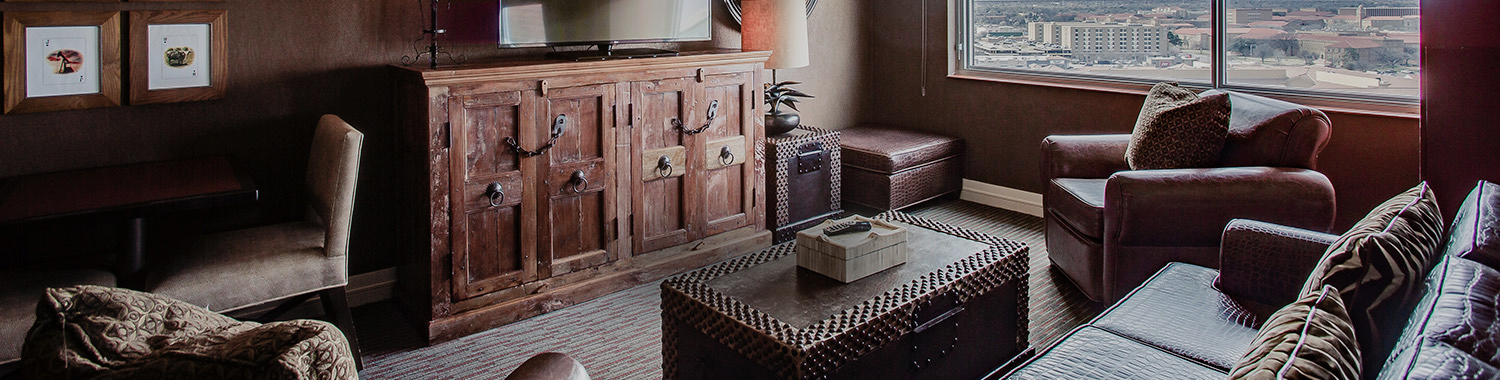 living room area with a coffee table and dark furniture