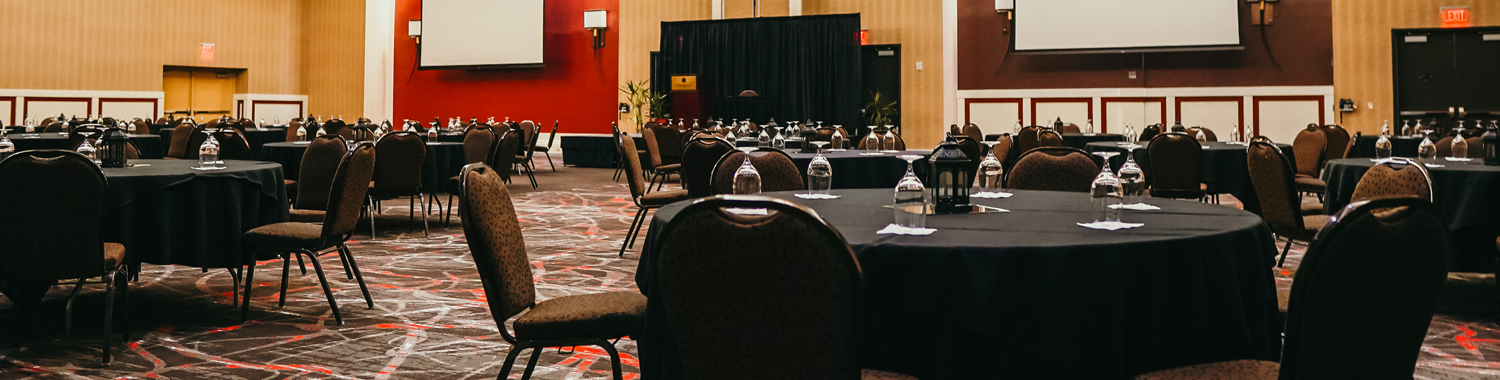 black tables and chairs in a meeting venue