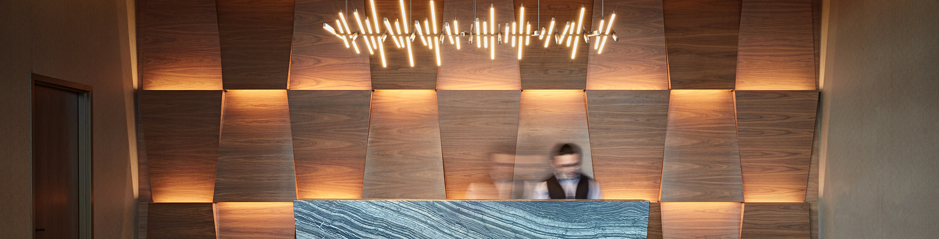 Reception of a hotel and a blurred man in the evening