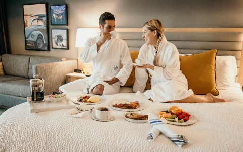 a couple enjoying room service