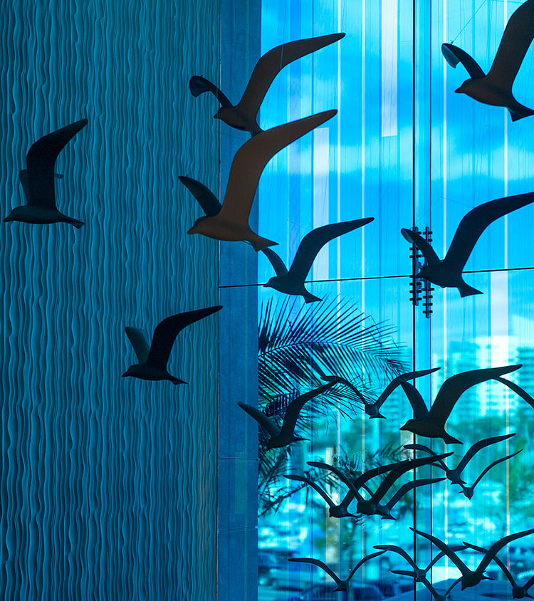 Sculpture of many seagulls with a blue background