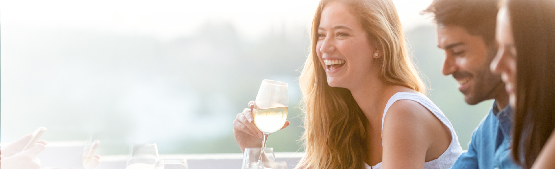 Woman smiling drinking wine