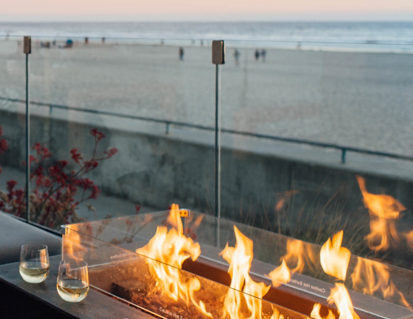 Fire pit by Pismo beach with two glasses of wine