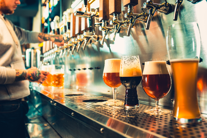 man pouring beer
