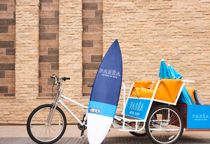 bike with pasea signs and a surfboard