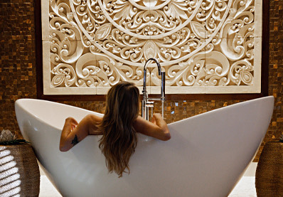 Woman relaxing in a bathtub