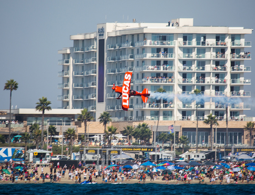 beach with people and a plane