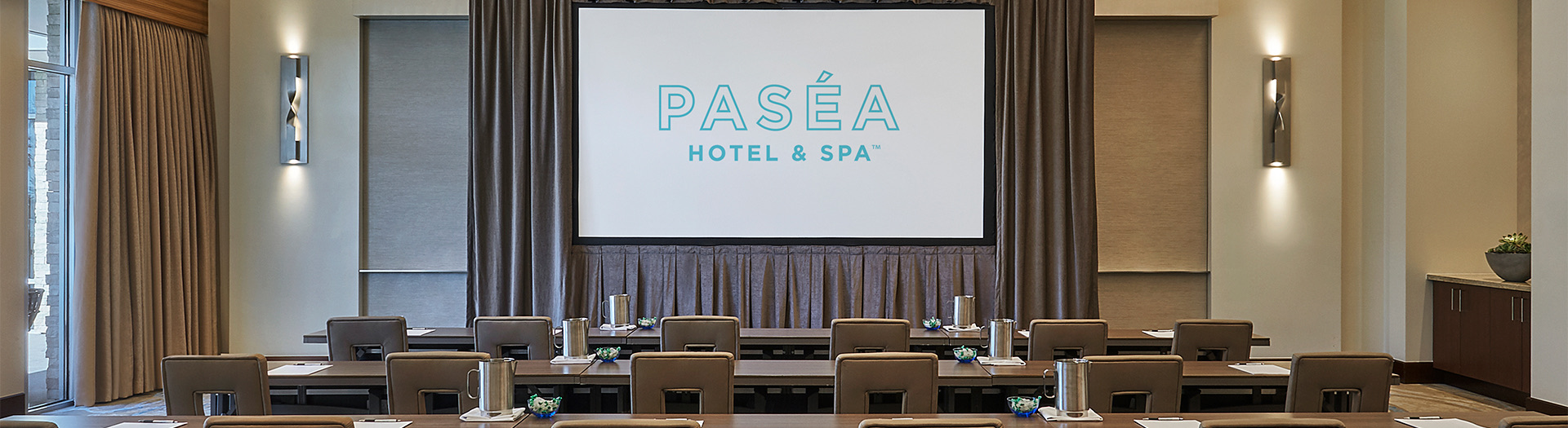 tables set up with a pasea sign