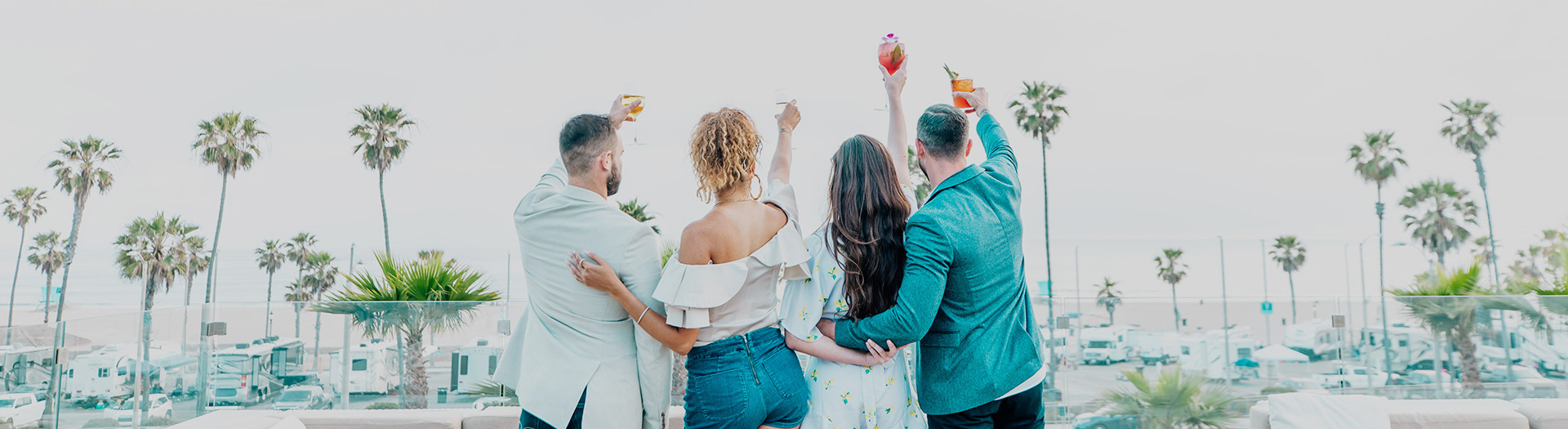 two couples cheering two the horizon