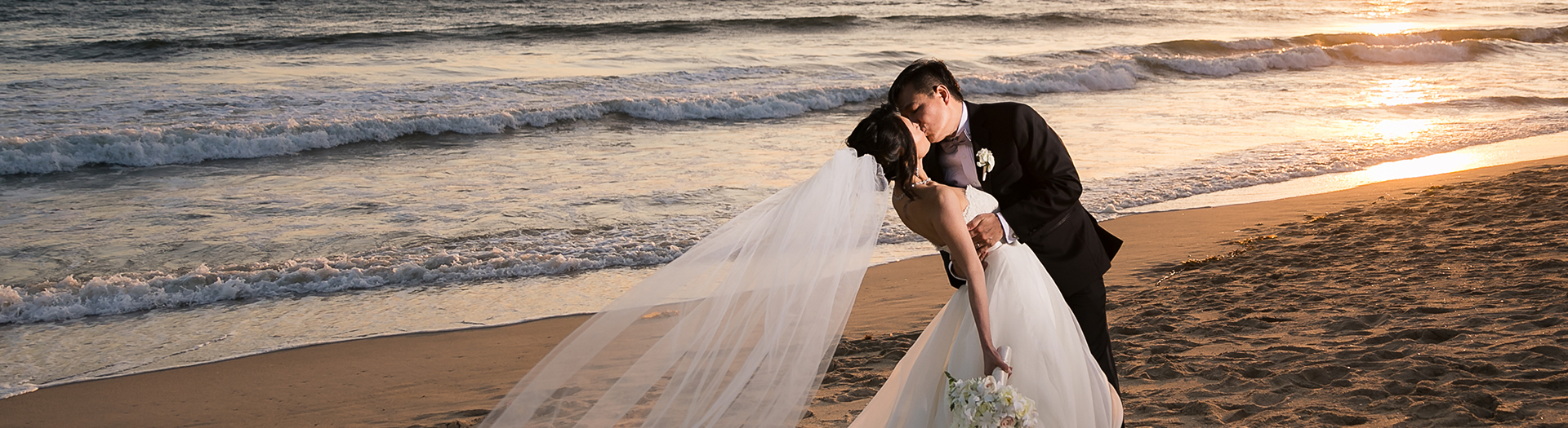couple kissing on the beach