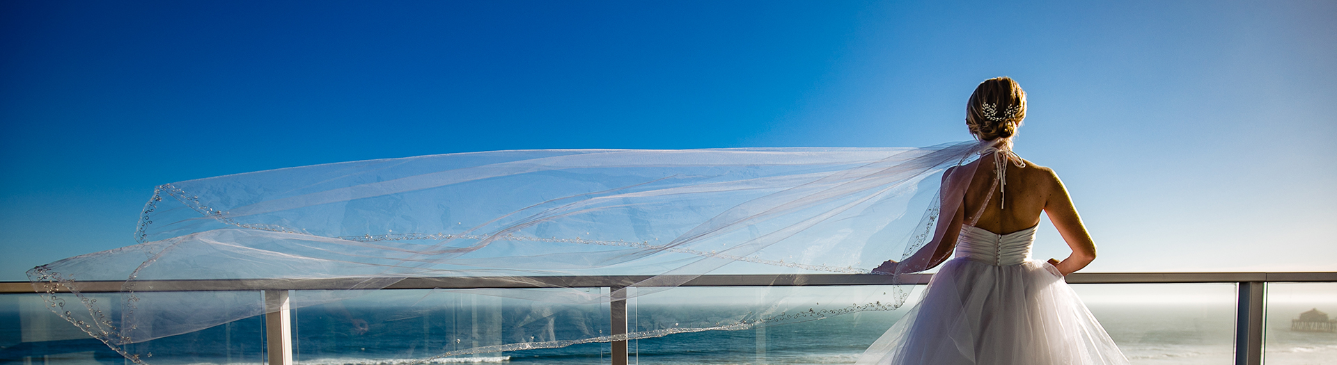 bride standing in front of the railing