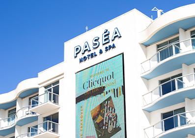 pasea hotel and spa sign with led sign beneath it