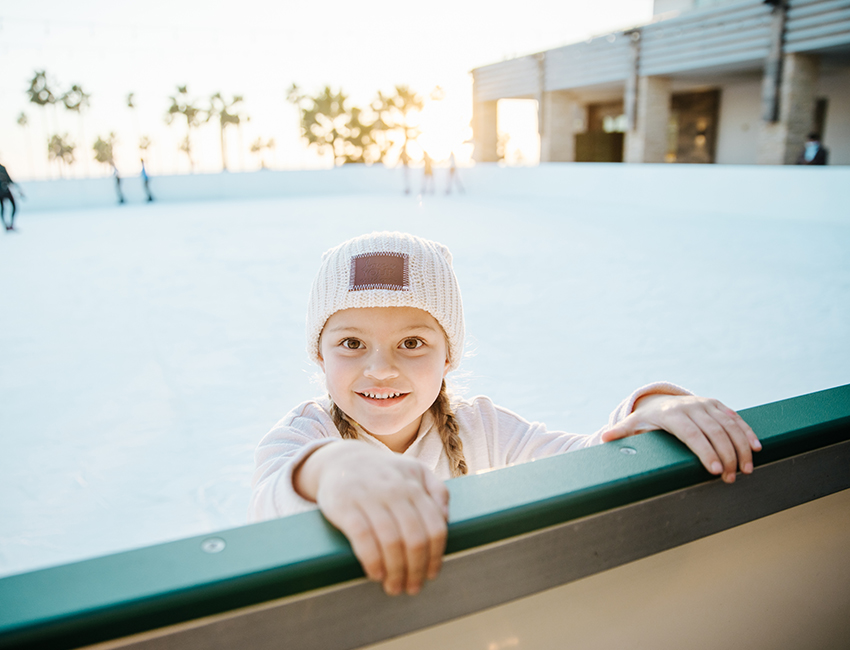 kid at ice skating rink column