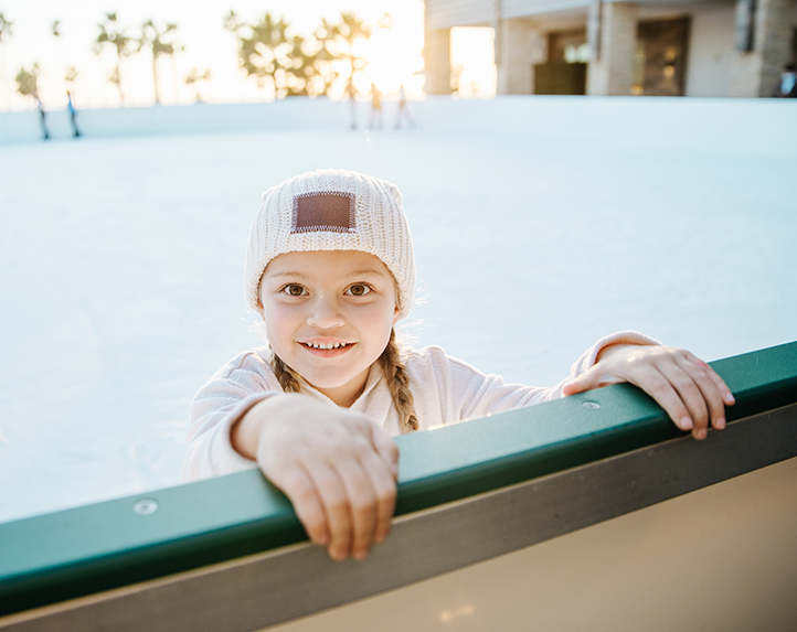 girl ice skating at holiday ice rink