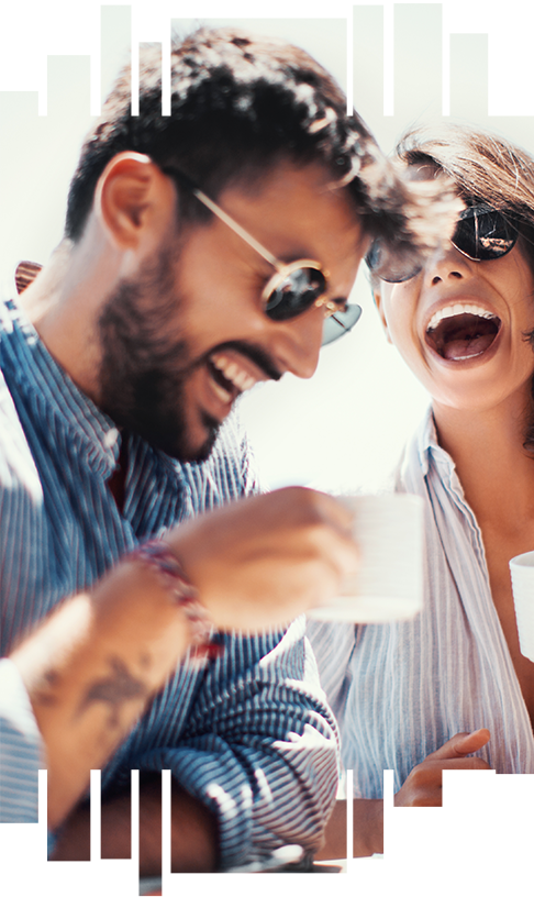 happy couple enjoying coffee laughing together