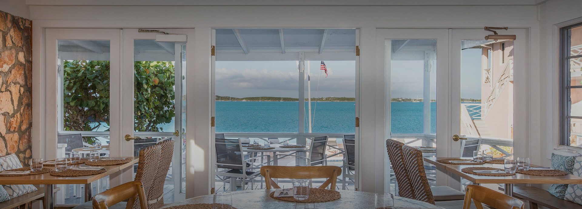 view from dining room looking out patio doors to ocean view