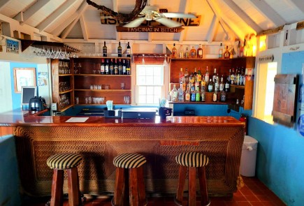 classic beach bar with liquor shelves 